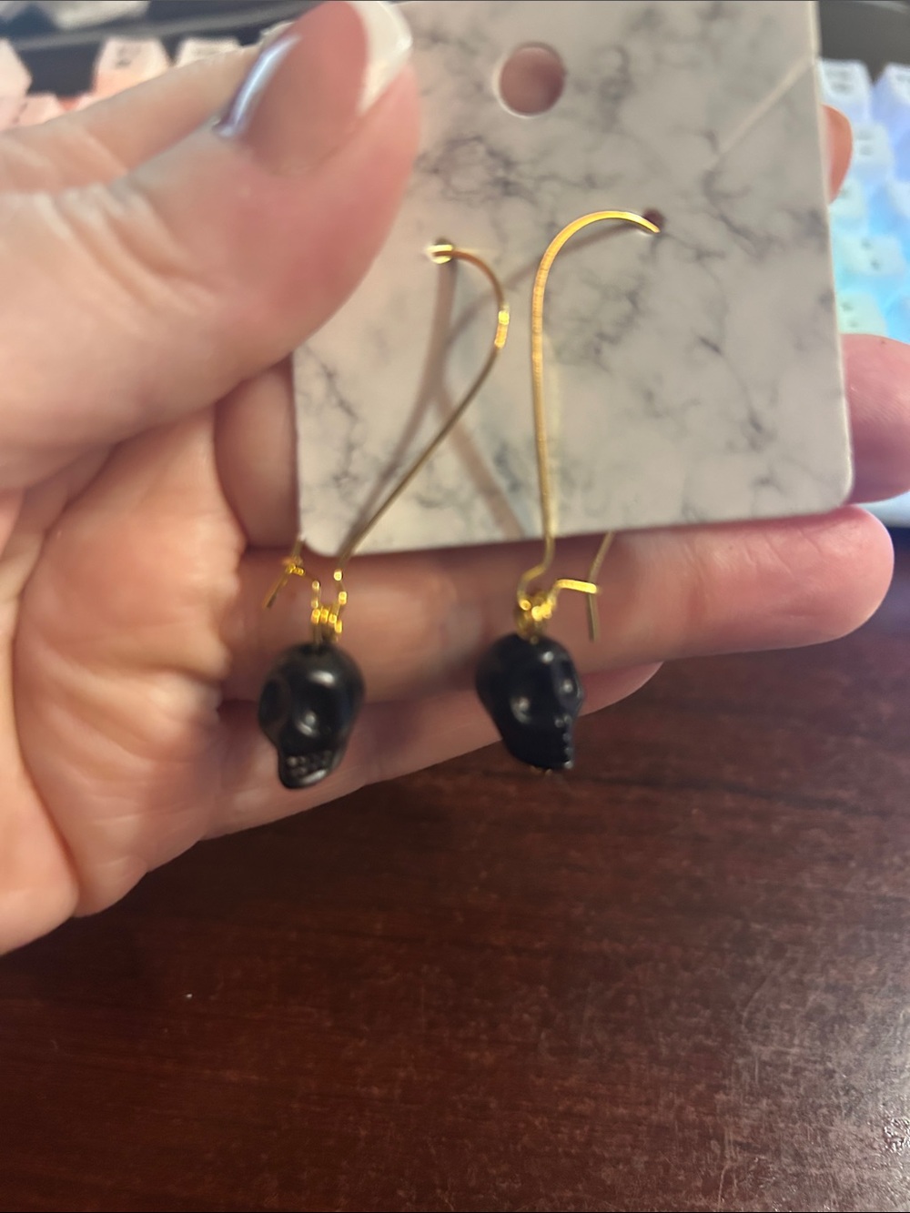 Gold Drop Earrings with Black Skull Charm